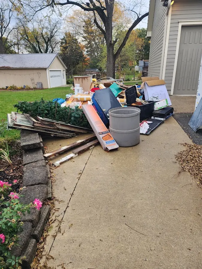 Dumpster being loaded with debris for 3 Yard Dumpster Rental in Conneaut